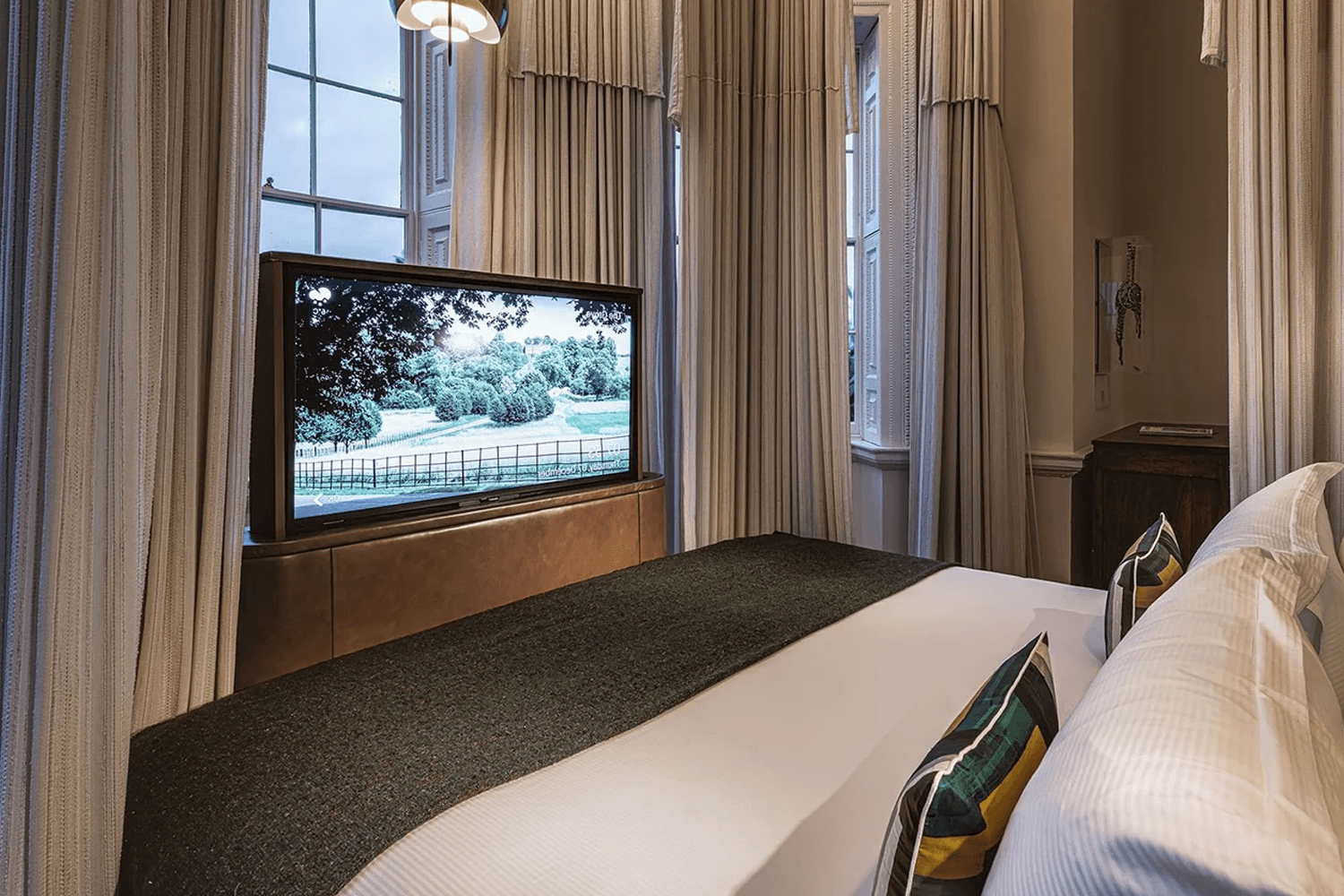 Bespoke bed with integrated under bed TV lift