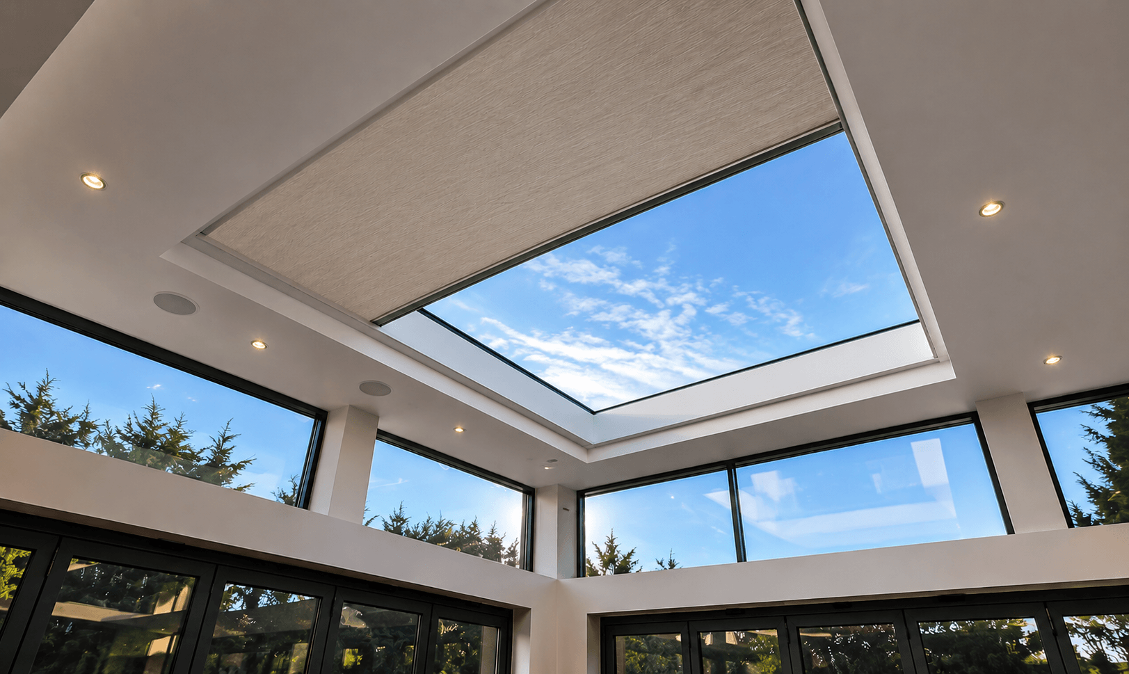 Motorised tensioned shade system installed in a luxury rooflight